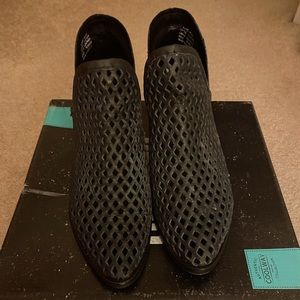 Black perforated ankle boots